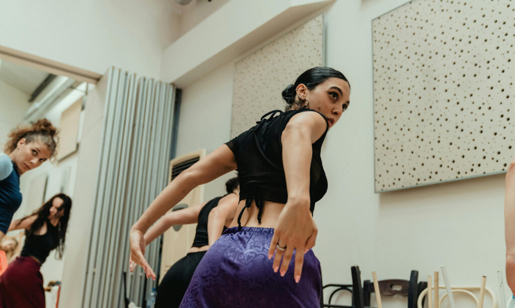 Adults in a dance studio learning choreography, showing how to start dancing as an adult