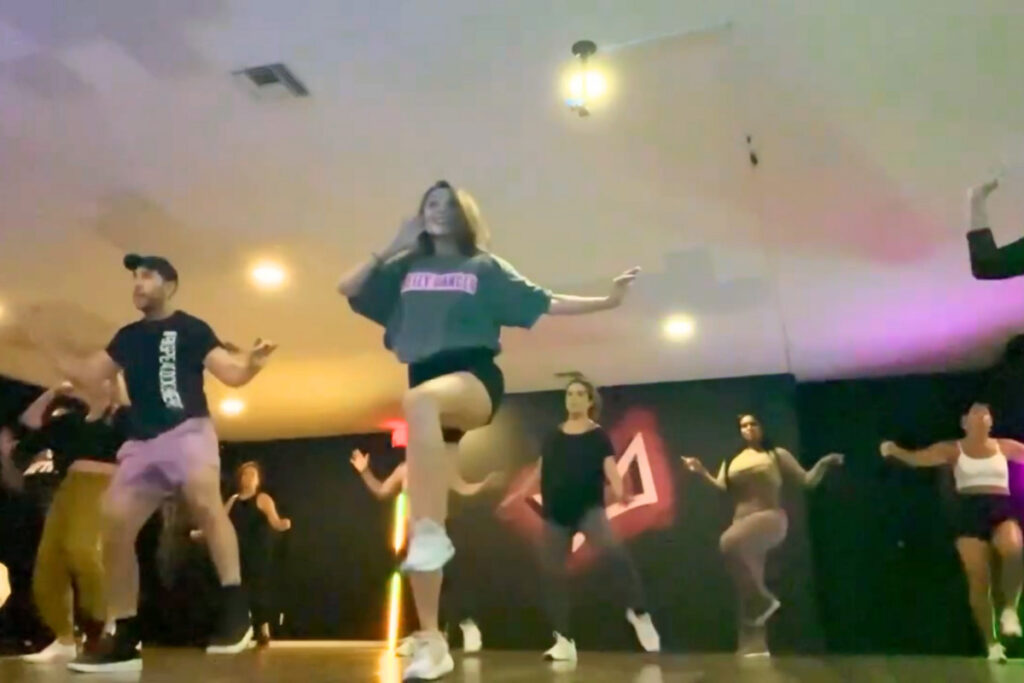 Beginner belly dance fitness class with Uyanga in Fort Lauderdale, people dancing in a studio