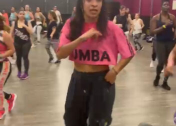 Maria teaching her Zumba class in Coral Springs, Florida, leading a group with high energy and upbeat music