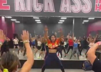 Maria leading a packed Zumba with Maria in Oakland Park class, full of energy and movement