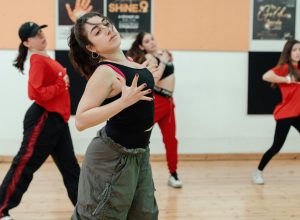 Adult beginner dancer connecting with music in a dance class